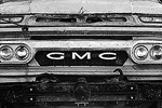 The front of an old rusty school bus.