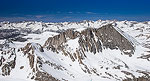 The snow covered Sierra Nevada Mountains and the East face of Mt. Tyndall seen from the summit of Mt. Williamson on a clear May morning.